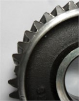 Different conditions of first gear: a) healthy; b) wear in gear; c) broken gear