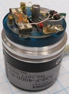 First modification of piezoelectric high resolution rotary table: a) photoelectric angular position encoder A36-F-4000-5V, b) rotating part, c) optimisation scheme for contact element trajectories :  1 – rotating part, 2 – precise ring, 3 – piezoelectric multilayer plate,  4 – contacting elements, 5 – spring, 6 – sectioned electrodes;  resonant frequency – 75.2 kHz, harmonic excitation amplitude – 10 V