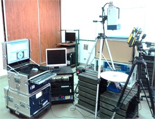 The scheme of a tested plate and the experimental setup during the modal analysis