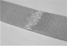 Photographs of representative test pieces of the examined laminates after bending tests