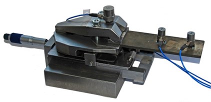 Variable stiffness holder: a) conceptual model, b) real original holder with mounted thin plate (workpiece) on which accelerometers are installed