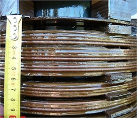a) Active part of the transformer used for the experimental tests  and b) top two discs of the winding lowered