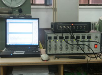 a) Dynamic testing set-up and b) data acquisition system