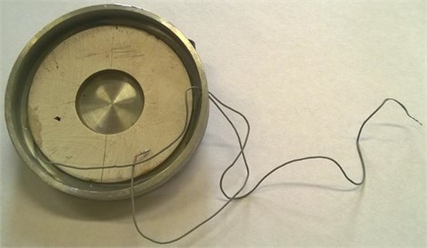 Manufactured vibroactive pads: a) 1st generation, with piezoelectric ring;  b) 2nd generation, with stack type piezoactuator [59]