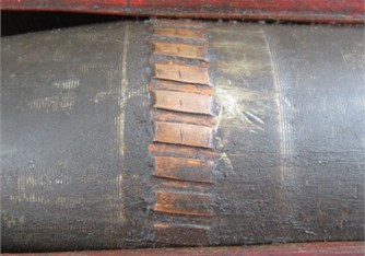 Engraved rotating band of a recovered projectile