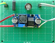 a) Schematic and b) PCB prototype of bridge rectifier / DC-DC buck converter circuit