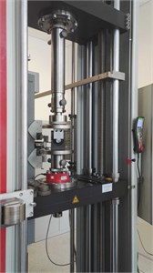 Arrangement of technical experiment for a determination of static characteristic of  a) rubber element and b) detail of test sample