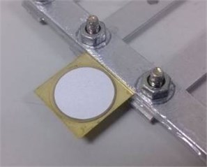 Piezoelectric unimorph clamped  by a fixture