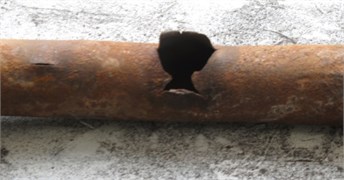 Most common damage mechanisms observed in boiler water-wall with carbon steel material (Steel20): a) Surface corrosion and erosion causing wall thinning, b) thick-lip burst caused by long-term overheating and creep damage – note multiple longitudinal cracks in the vicinity of a burst