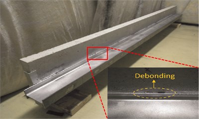 Steel-reinforced concrete slab with zoomed-in view of debonding
