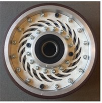 Wheel with the vibration damping system: a) components: 1 – inner bush, 2 – outer tyre,  3 – webbing, 4 – bearing assembly, 5 – outer wheel raceway polymer material,  6 – thin resilient bush, b) an assembled wheel with the vibration damping system