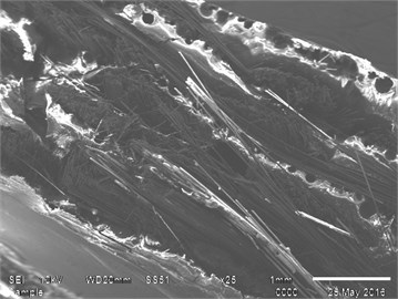 SEM image showing fracture running along fiber-matrix material and flexural tested specimen