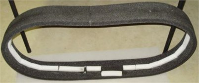 Tire Silencer with white rigid foam support removed from tire after 1,053 miles  (source from Schmidt and Majumdar, 2011 [110],  Fig. 2; reprinted under fair use provision)