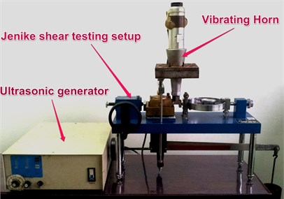 The modified Jenike shear cell for testing discrete media under vibration compaction