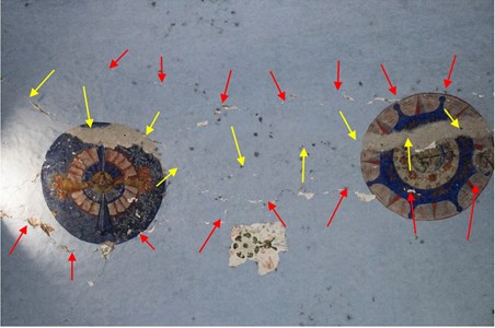 Longitudinal cracks on the intrados of the main vault. The original crack (yellow arrows)  and the new ones following the previous one at both sides (red arrows) are shown