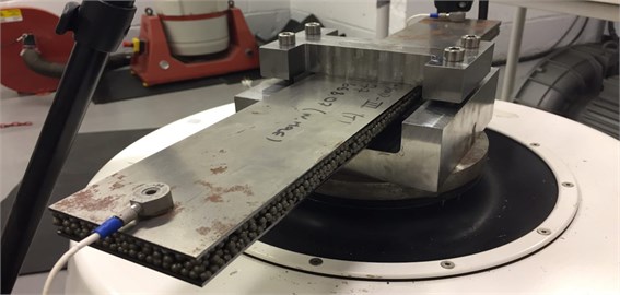 Test set-ups: a) the Hollomet Specimen 500D (clamped in the middle) with sand intrusion,  b) the Hollomet Specimen 290D (clamped on one end) with sand intrusion,  c) detail view of the 500D with the attached sensors