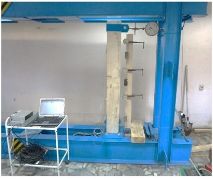 Laboratory setup: a) photo and b) a scheme of wooden rack. Legend: 1, 2, 3 in a circle – control points, indicator numbers; P – direction and point of force action