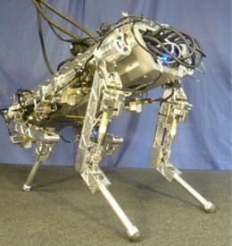 Physical images of a hydraulic four-legged robot a) in 2012, robot images with stereo cameras were not installed, b) in 2012, robot images with stereo cameras were installed