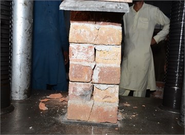 Crushed English-bond bricks column  after compressive strength test