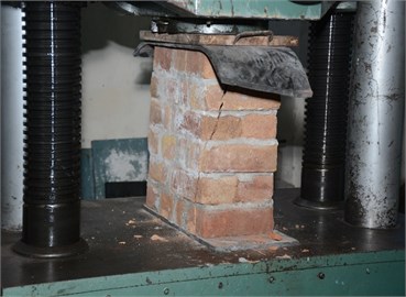Crushed English-bond bricks column  after compressive strength test