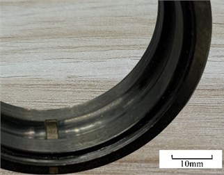 Experimental bearing, a) defective bearing ER-16k, b) fabricated defect on outer raceway