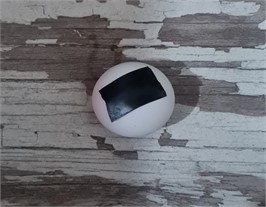Faulty ping-pong ball and intact ping-pong ball