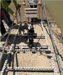 a) Frontal view of the homemade upright bank wall model,  b) sonar and model fixed to the measurement stand