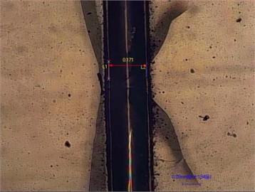 Analysis of the influence of processing power and surface water film on the edge collapse of microchannel