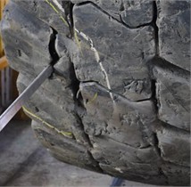 a), b) Damage by foreign object and c) sharp rock