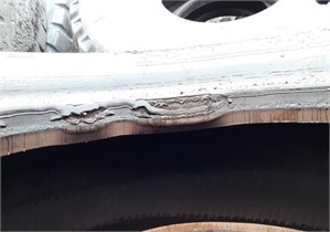 a) Disturbance of rubber structure and b) its damage on the boarding surface