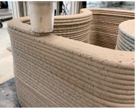3D-printing of a staircase using the optimum 3D-printable geopolymer mixture (M5):  a) 3D model of the staircase; b) during 3D-printing process; c) 3D printed staircase [11]