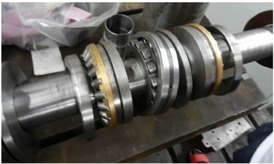 Structure diagram of combined bearing: 1 – disc spring compression washer; 2 – aligning roller bearing; 3 – bearing washers; 4 – thrust self-aligning roller bearing; 5 – disc spring washer;  6 – disc spring; 7 – disc spring thrust block. Photo by WANG Weiping on July,  2025 at the Metalworking Practice Base, Yangtze University