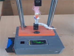Tensile testing of ultrasonic welded seams at 50 mm/min cross-head speed: custom testing apparatus using digital force - measurement system; Photographs taken by N. Palvannazirova  Materials Testing Laboratory TITLI Tashkent Uzbekistan December 2023