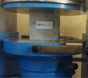 Testing process of fiber concrete based on polypropylene fibers. Photo taken by Asalxon Juraeva at the Namangan State Technical University Laboratory, June 2025