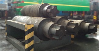 Implementation of the testing process: a) test loads of different weights;  b) placement of the loads onto the locomotive frame using a crane