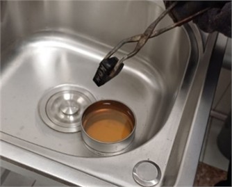 Oil quenching process. Photo taken by M.Z. Ubaydullaev (co-author) in the laboratory of the Almalyk Branch of NUST MISIS, 2025)