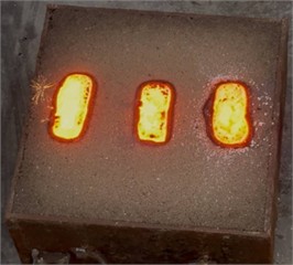 Poured castings in a sand and clay mold. Photo taken by the authors in the laboratory of the Almalyk Branch of NUST MISIS, 2025