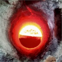 Modification of liquid metal at the junction using the sandwich method: a) khaki view of the placement of modifiers in the bucket, b) schematic view of the sandwich method, c) the pouring of liquid metal from the oven into the bucket and the reaction process. The original photographs were obtained  in the laboratory of JSC “Foundry and Mechanical Plant”, in Tashkent, the images  were obtained in 2024-2025, the author is U.T. Rakhimov