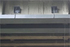 Concrete beams of the bridge span structure: a), b) defects in concrete bridge beams  in the form of exposure, active corrosion, and broken wire strands; c) view of the outer beams  of the bridge, reinforced with MMA-adhered external reinforcement