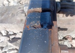 Defects in the rail joint zones. The photograph, taken during research conducted  by a third author in 2024-2025, depicts the process of studying issues  in the railway superstructure elements within the rail joint zones