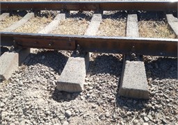 Defects in the rail joint zones. The photograph, taken during research conducted  by a third author in 2024-2025, depicts the process of studying issues  in the railway superstructure elements within the rail joint zones