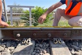 Inspection of bridge transition and rail joint zones as the main object of the study. The photograph, taken by the third author during research conducted in 2024-2025, depicts the processes of measuring and monitoring the railway bridge transition and rail joint zones using the SUP-3 track gauge template