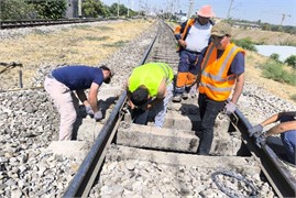 The process of installing elastic sleeper pads in the rail joint zone. The photograph, taken  by the third author on August 29, 2025, shows the process of conducting experimental  research on the installation of elastic under-sleeper pads