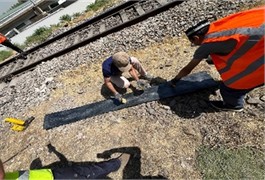 The process of installing elastic sleeper pads in the rail joint zone. The photograph, taken  by the third author on August 29, 2025, shows the process of conducting experimental  research on the installation of elastic under-sleeper pads