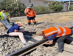 The process of installing elastic sleeper pads in the rail joint zone. The photograph, taken  by the third author on August 29, 2025, shows the process of conducting experimental  research on the installation of elastic under-sleeper pads