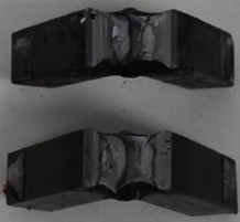 Impact toughness testing of specimens a) with and b) without the modifier. Photo by the authors in the laboratory of the Almalyk Branch of NUST MISIS, 2026