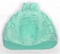 Laboratory procedure: a) the working models mounted on the articulator; b)-c) after building the direct tracks with modelling wax; d)-e) duplication and cast model; f) mock-up acetate trays made on duplicated model