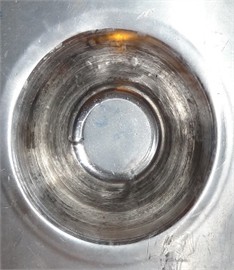 a) Geometry of the formed hyperbolic part, b) laminated sheet after performing the SPIF process