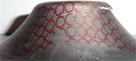 Deformed circular grid pattern in the necked zone of the formed hyperbolic part, shown across the curved wall